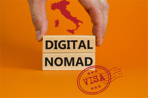 Wooden blocks spelling 'DIGITAL NOMAD' with Italy map and visa stamp on an orange background