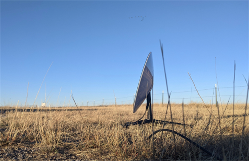 Starlink satellite dish installed in a rural Romanian field