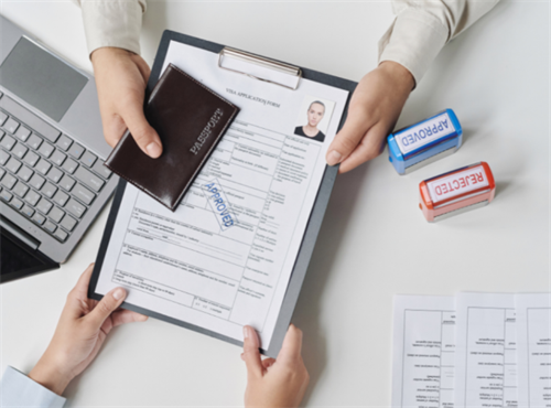 Approved visa application form with passport